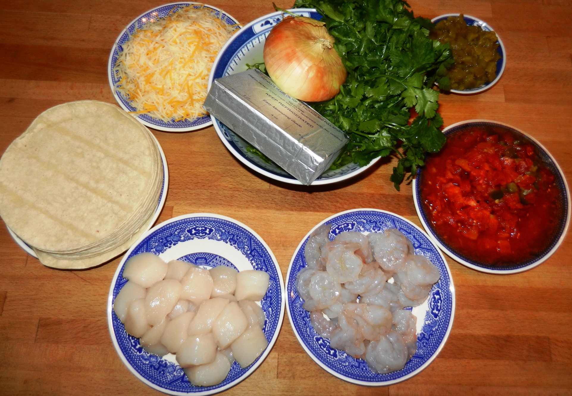 enchiladas burritos seafood shrimp scallops cheesy casserole tortillas